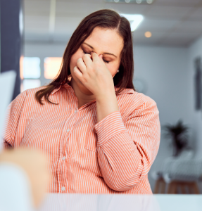 an-overweight-woman-looking-upset